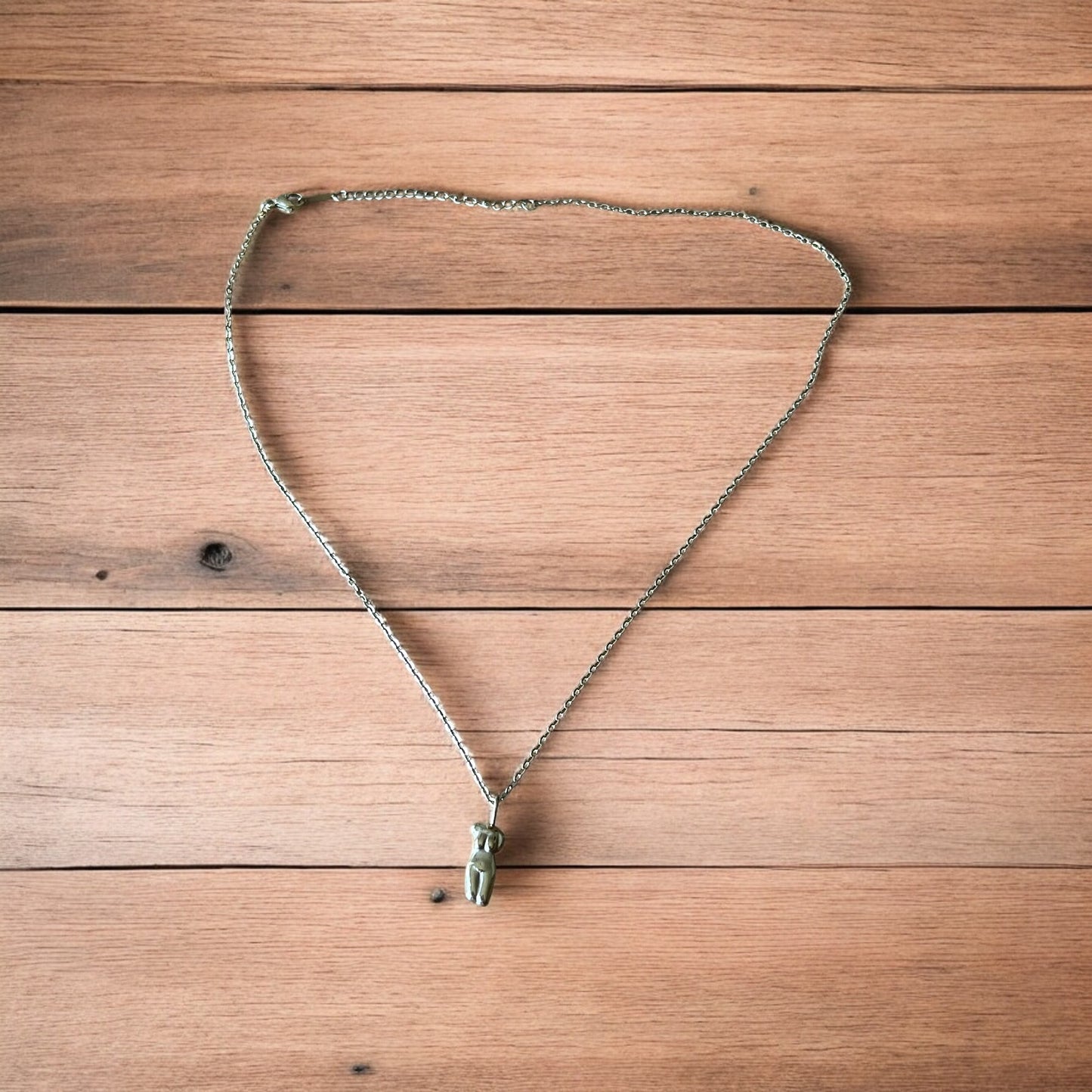 Lovely Gold stainless steel necklace of female woman figure silhouette body.