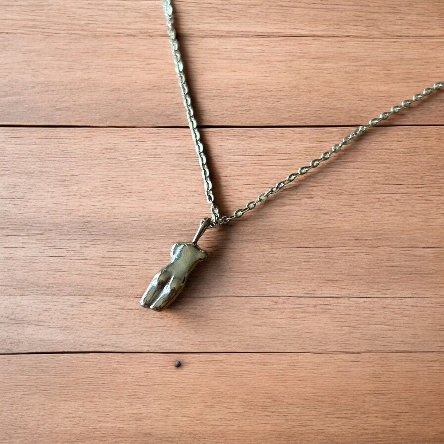 Lovely Gold stainless steel necklace of female woman figure silhouette body.