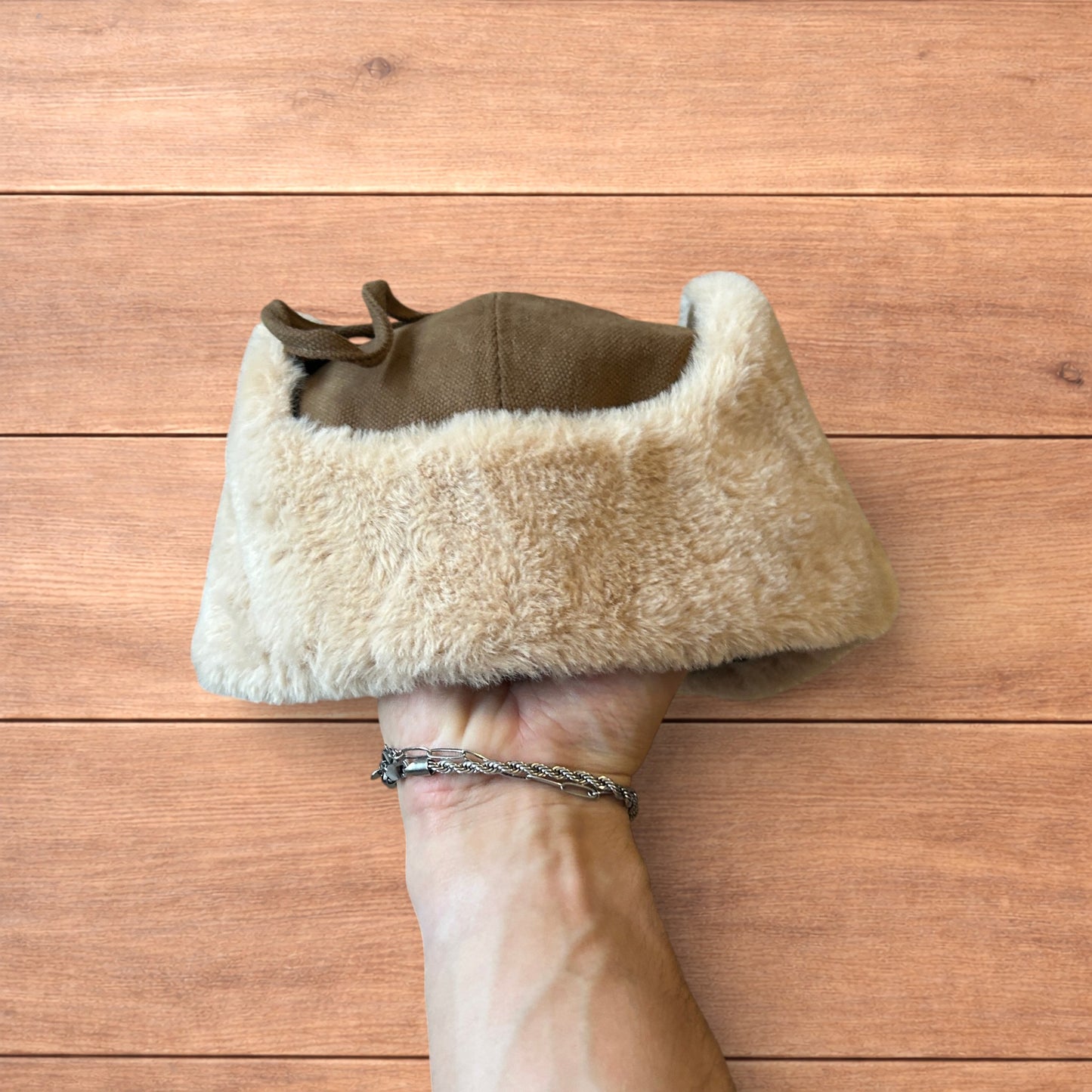 Russian ushanka trapper ear flap winter hat in brown/beige colour way.