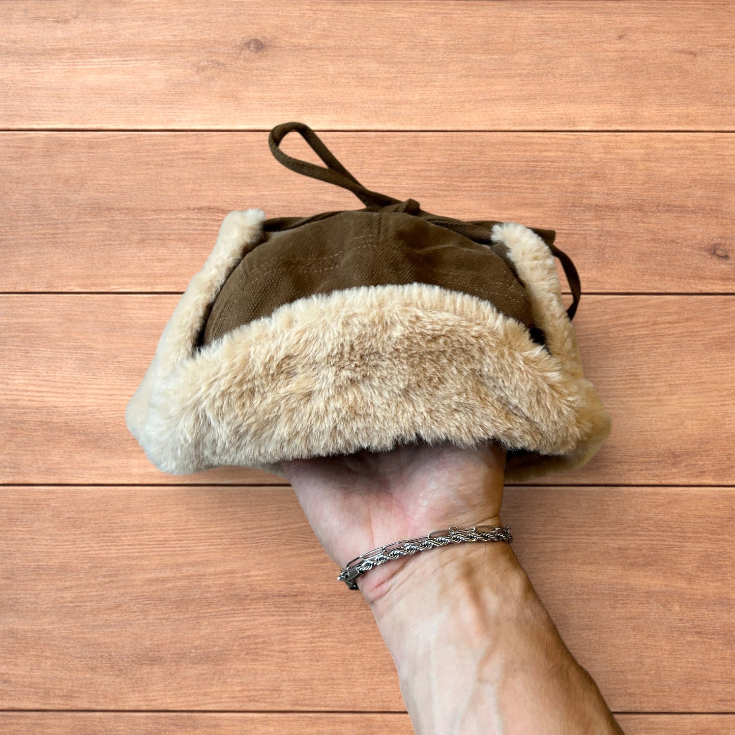 Russian ushanka trapper ear flap winter hat in brown/beige colour way.