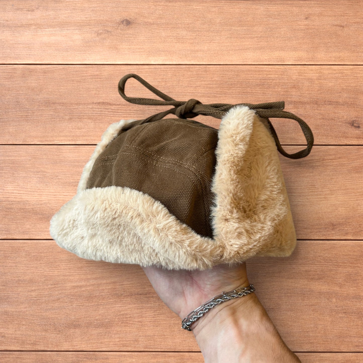 Russian ushanka trapper ear flap winter hat in brown/beige colour way.