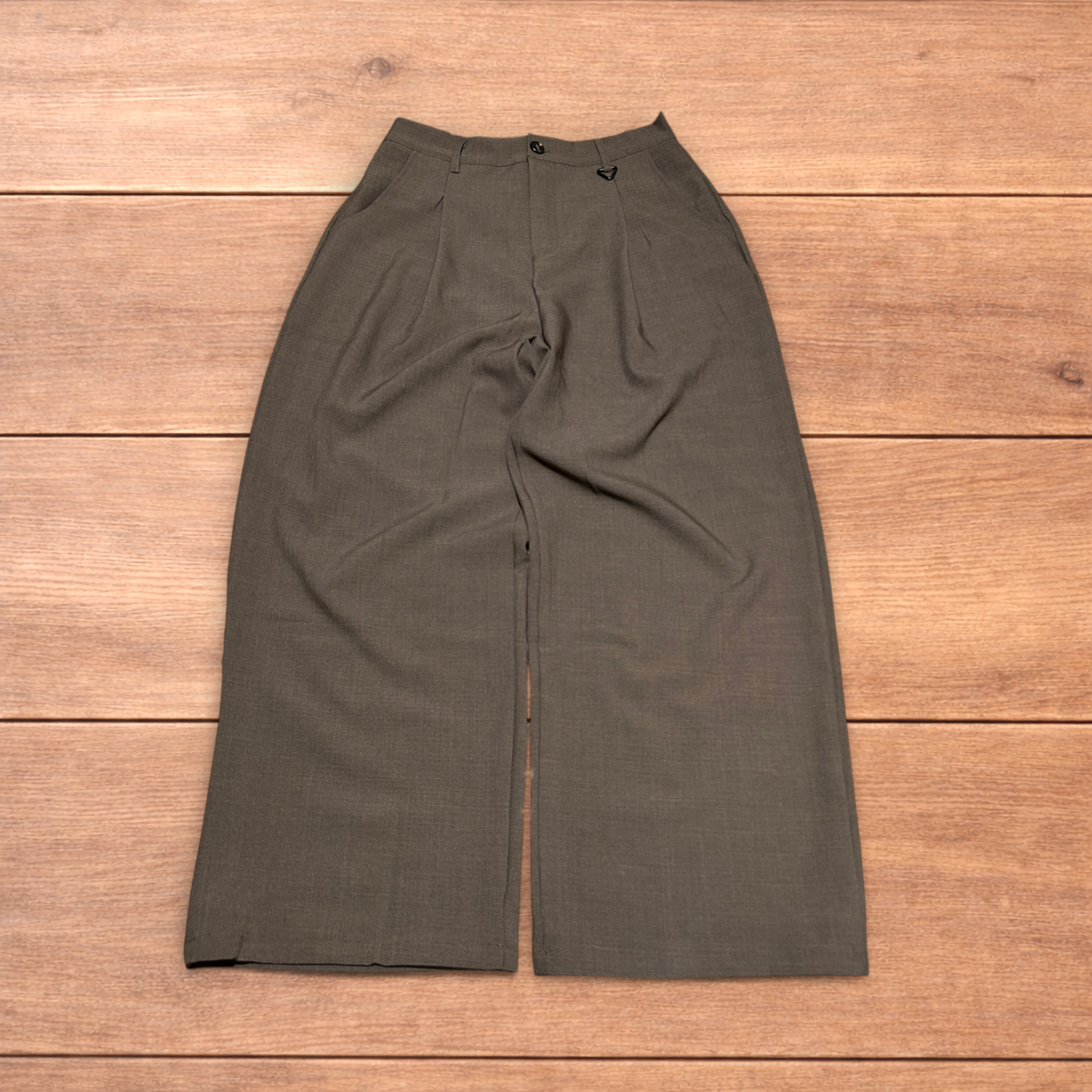 Vintage style baggy wide leg tailored brown trousers laid flat showing front, back, waistband, and clasp detail