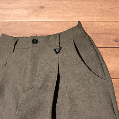 Vintage style baggy wide leg tailored brown trousers laid flat showing front, back, waistband, and clasp detail