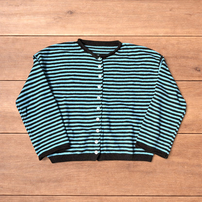 Turquoise and black striped vintage knitted cardigan jumper with button-up front laid flat on wooden surface.