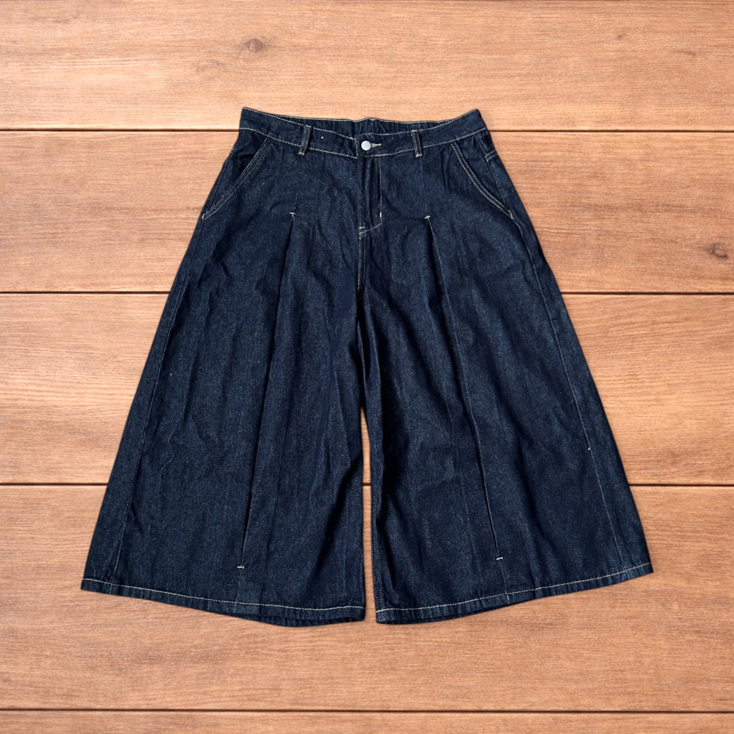 Super baggy wide leg raw denim style 3/4 shorts jorts in dark indigo blue.
