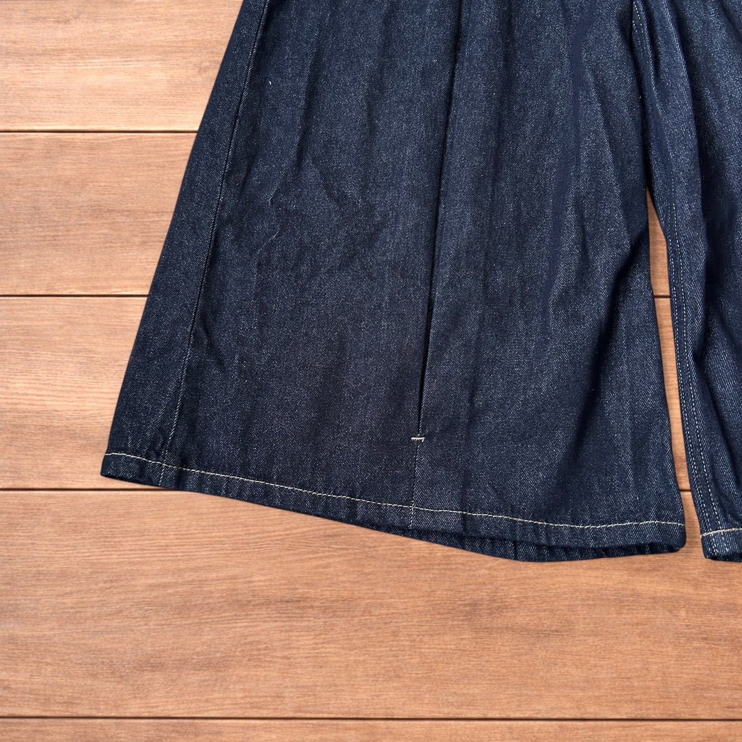 Super baggy wide leg raw denim style 3/4 shorts jorts in dark indigo blue.