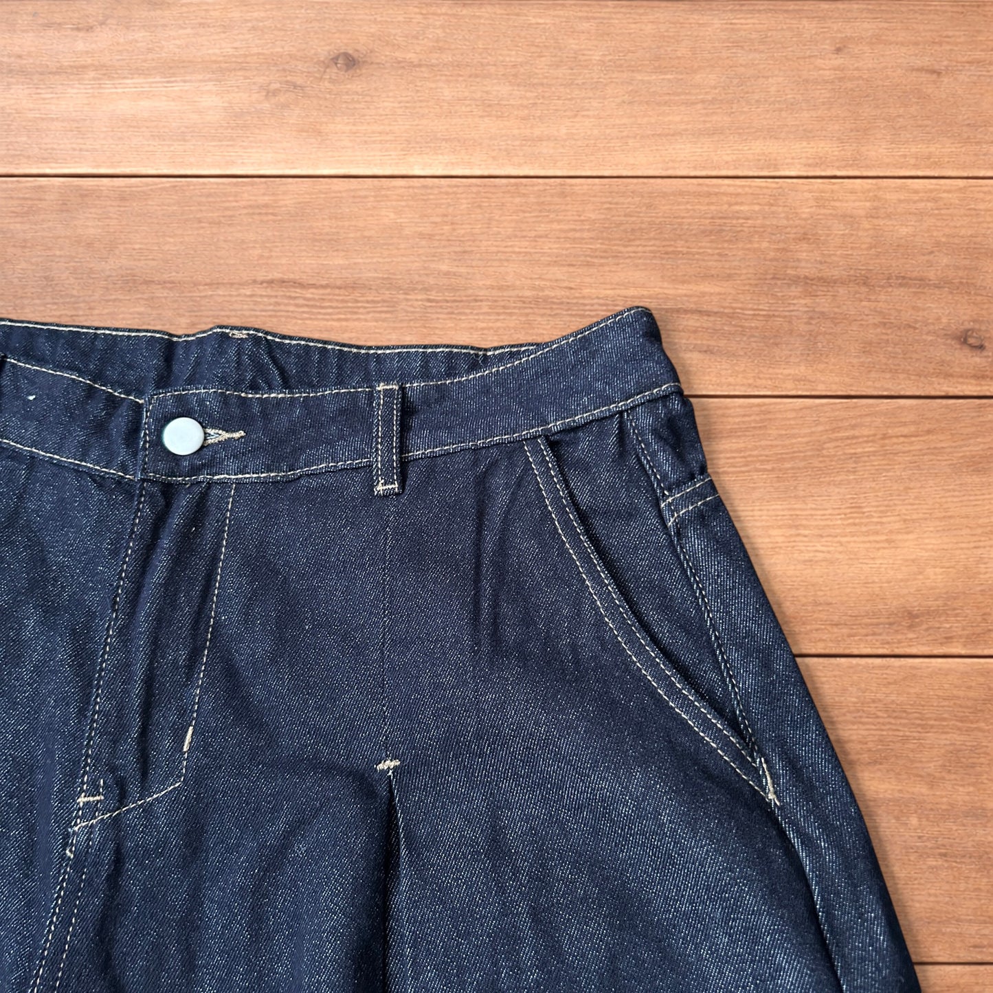 Super baggy wide leg raw denim style 3/4 shorts jorts in dark indigo blue.