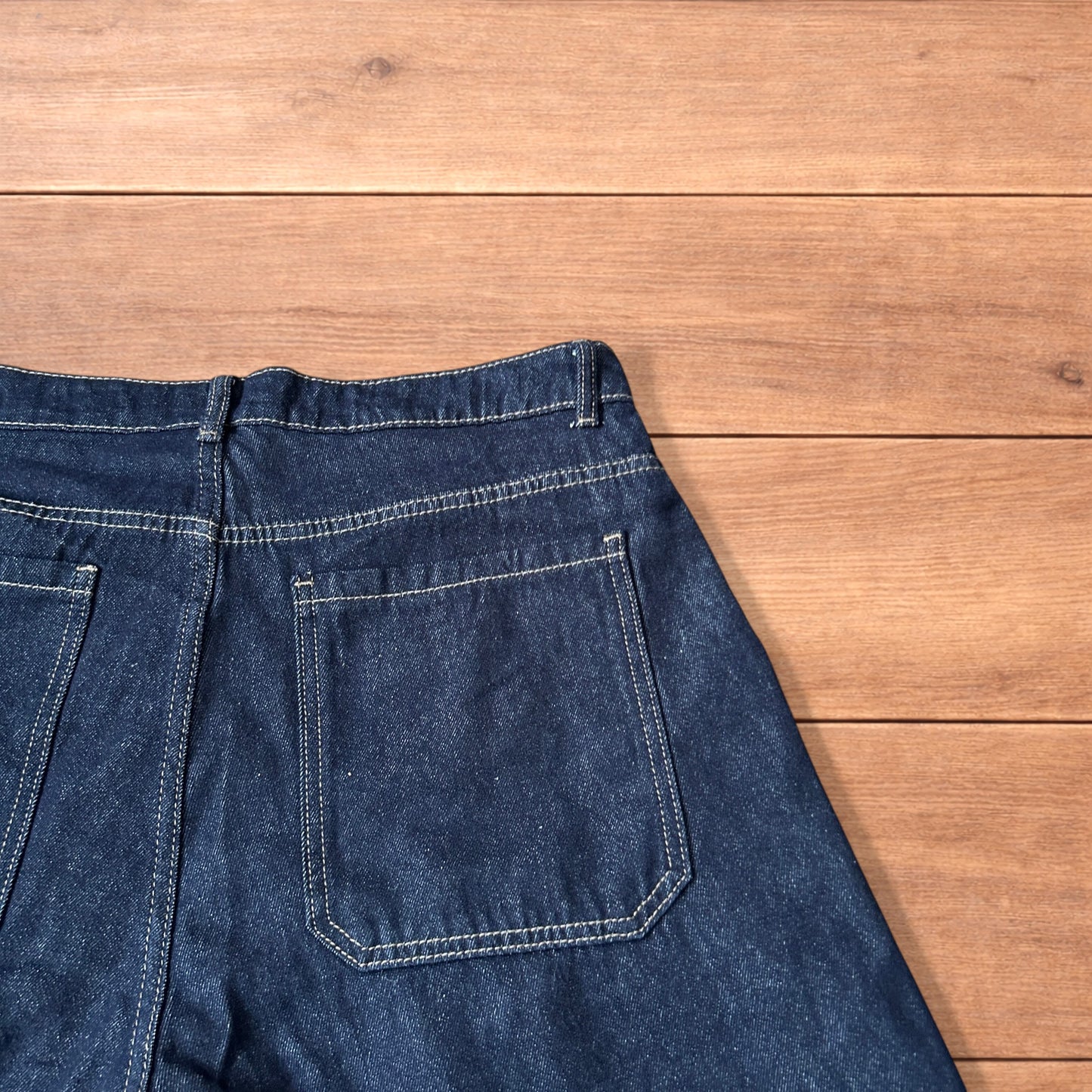 Super baggy wide leg raw denim style 3/4 shorts jorts in dark indigo blue.