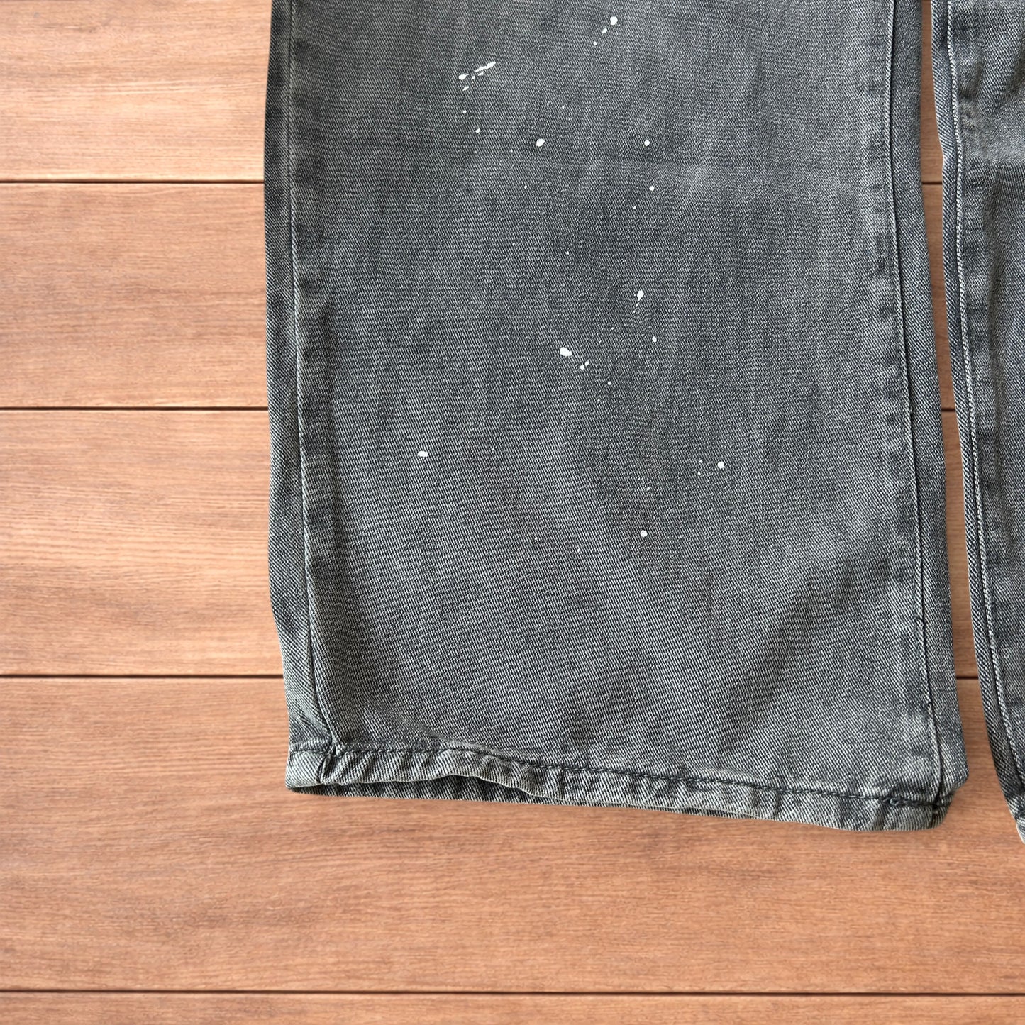 Vintage style baggy wide leg skater fit jeans in grey with paint splatters.