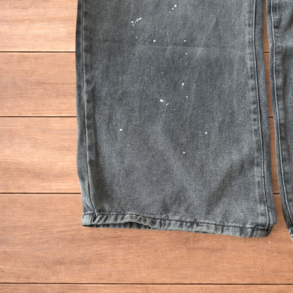 Vintage style baggy wide leg skater fit jeans in grey with paint splatters.