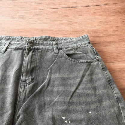 Vintage style baggy wide leg skater fit jeans in grey with paint splatters.