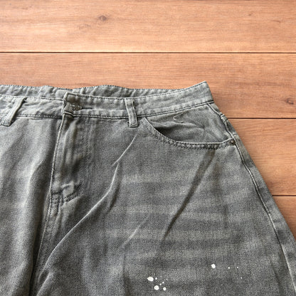 Vintage style baggy wide leg skater fit jeans in grey with paint splatters.