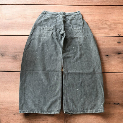 Vintage style baggy wide leg skater fit jeans in grey with paint splatters.