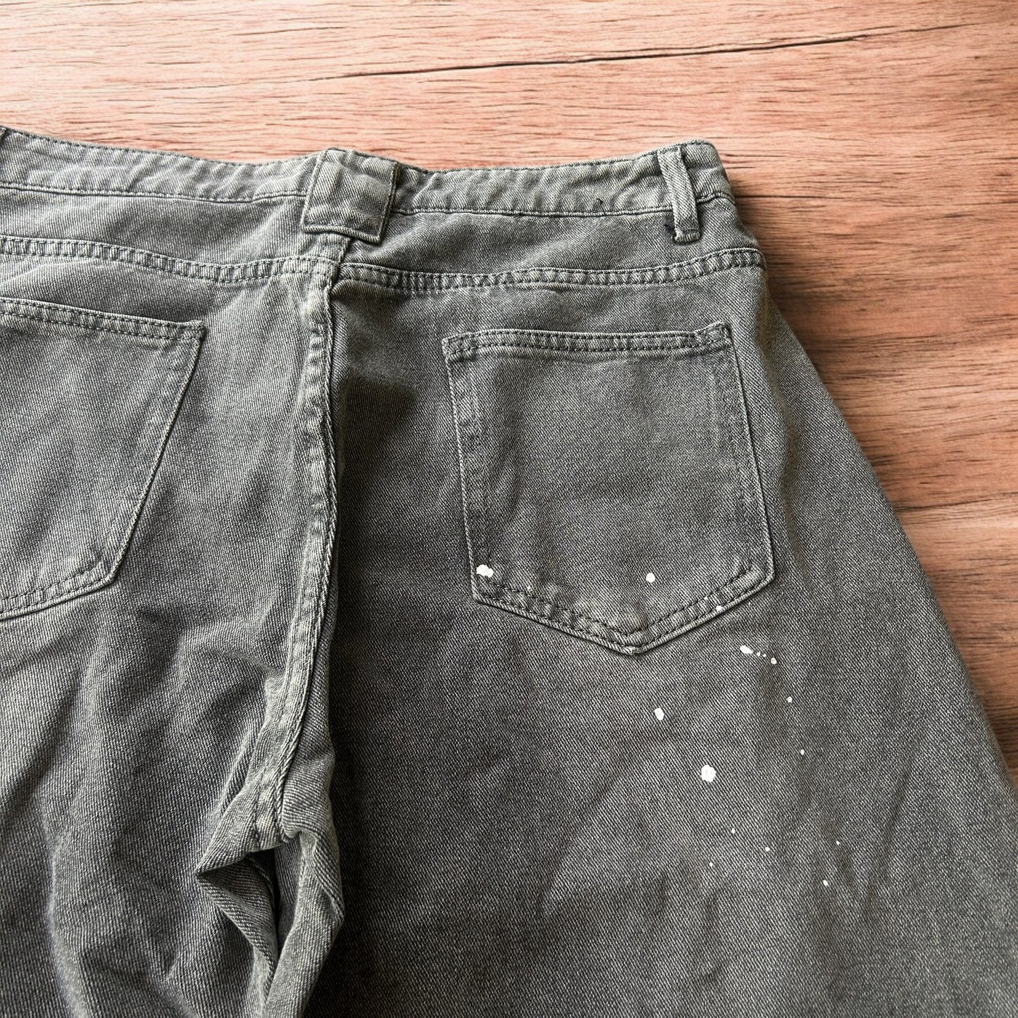 Vintage style baggy wide leg skater fit jeans in grey with paint splatters.