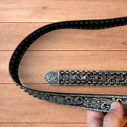 Vintage style faux leather western cowboy gothic belt in black with silver trim.