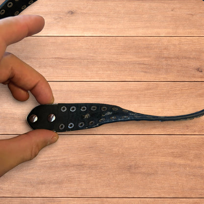 Vintage style faux leather western cowboy gothic belt in black with silver trim.