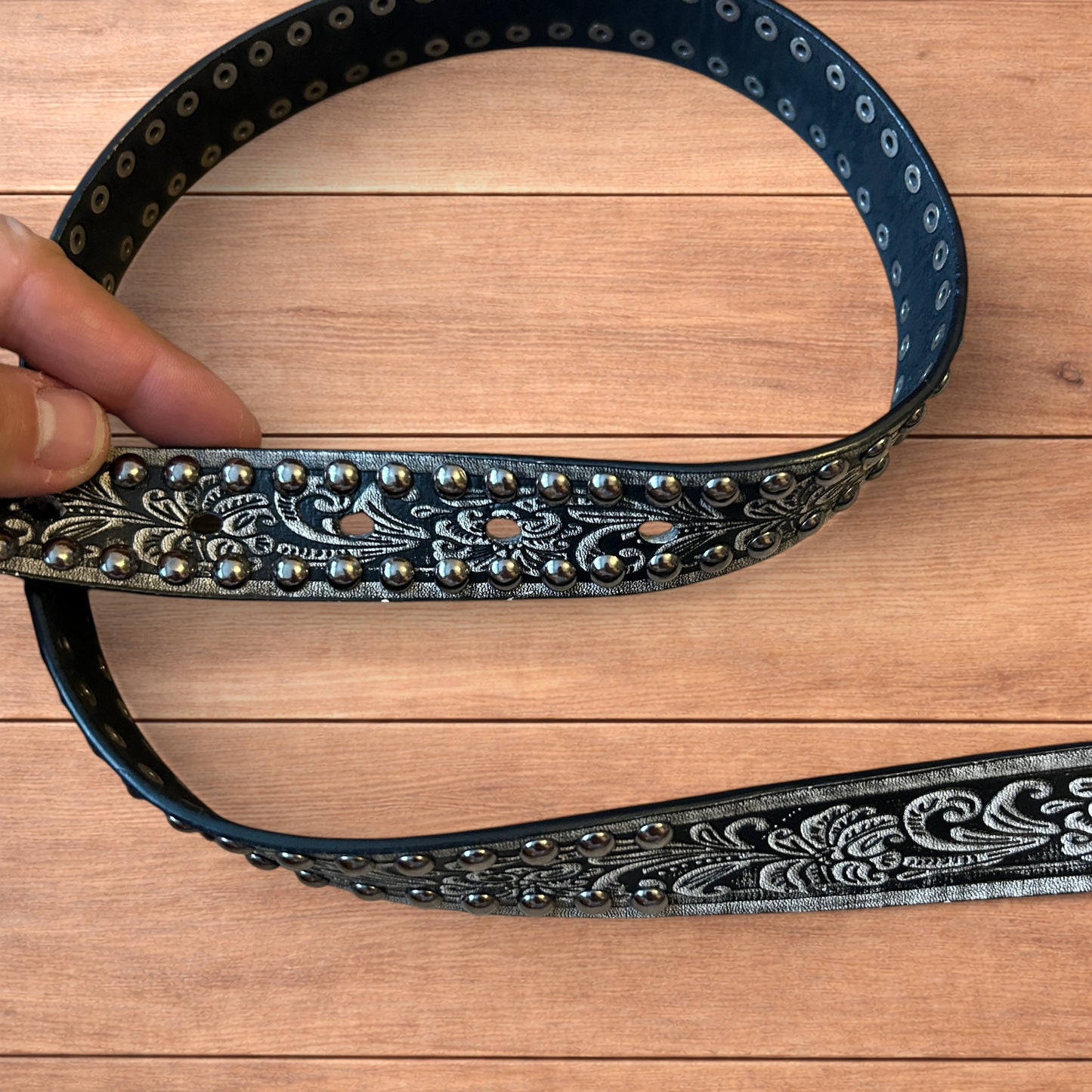 Vintage style faux leather western cowboy gothic belt in black with silver trim.