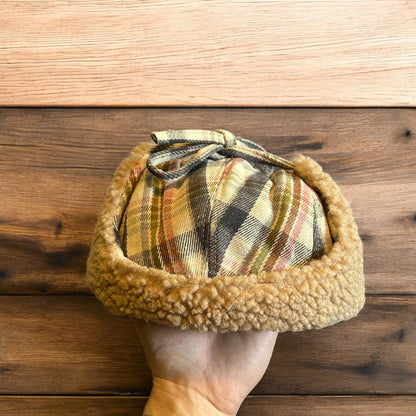 Trapper ear flap winter hat in checkered beige colour way. One size.