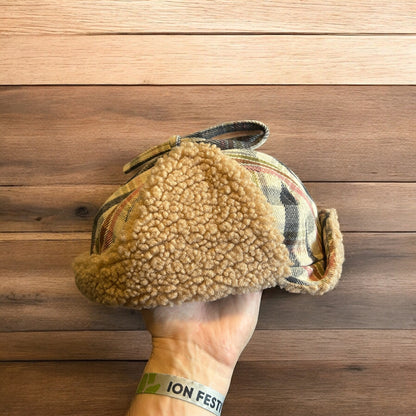 Trapper ear flap winter hat in checkered beige colour way. One size.