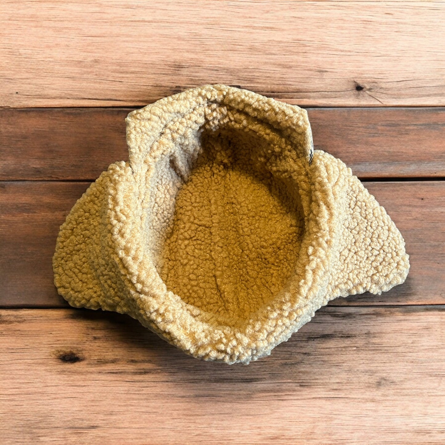 Trapper ear flap winter hat in checkered beige colour way. One size.