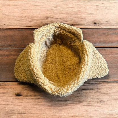 Trapper ear flap winter hat in checkered beige colour way. One size.