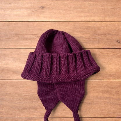 Vintage style dappy ear flap bobble hat in dark red.