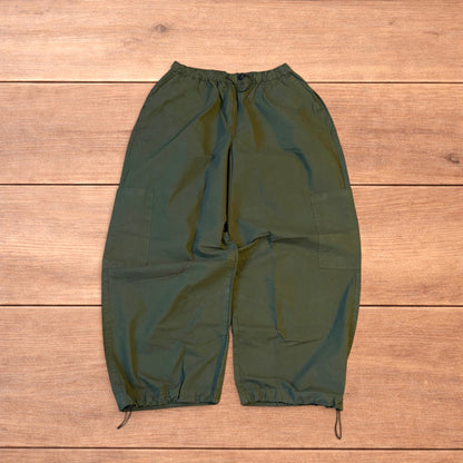 Baggy wide leg ripstop cargo trousers in khaki green with pockets, elasticated waist, and toggled hems.