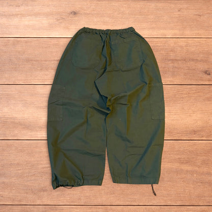 Baggy wide leg ripstop cargo trousers in khaki green with pockets, elasticated waist, and toggled hems.