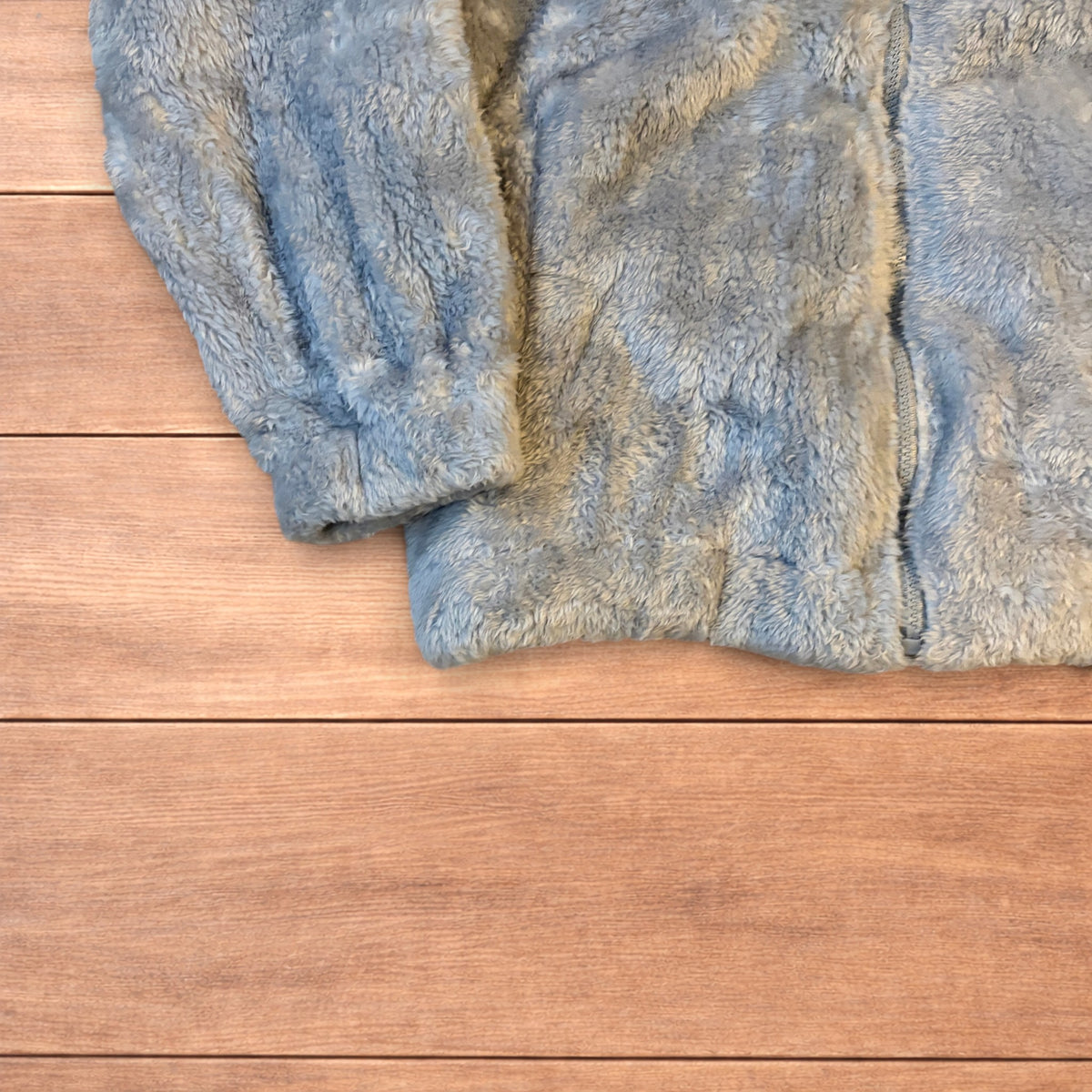 Pale blue fluffy fleece full zip jacket with elasticated hem and high neck
