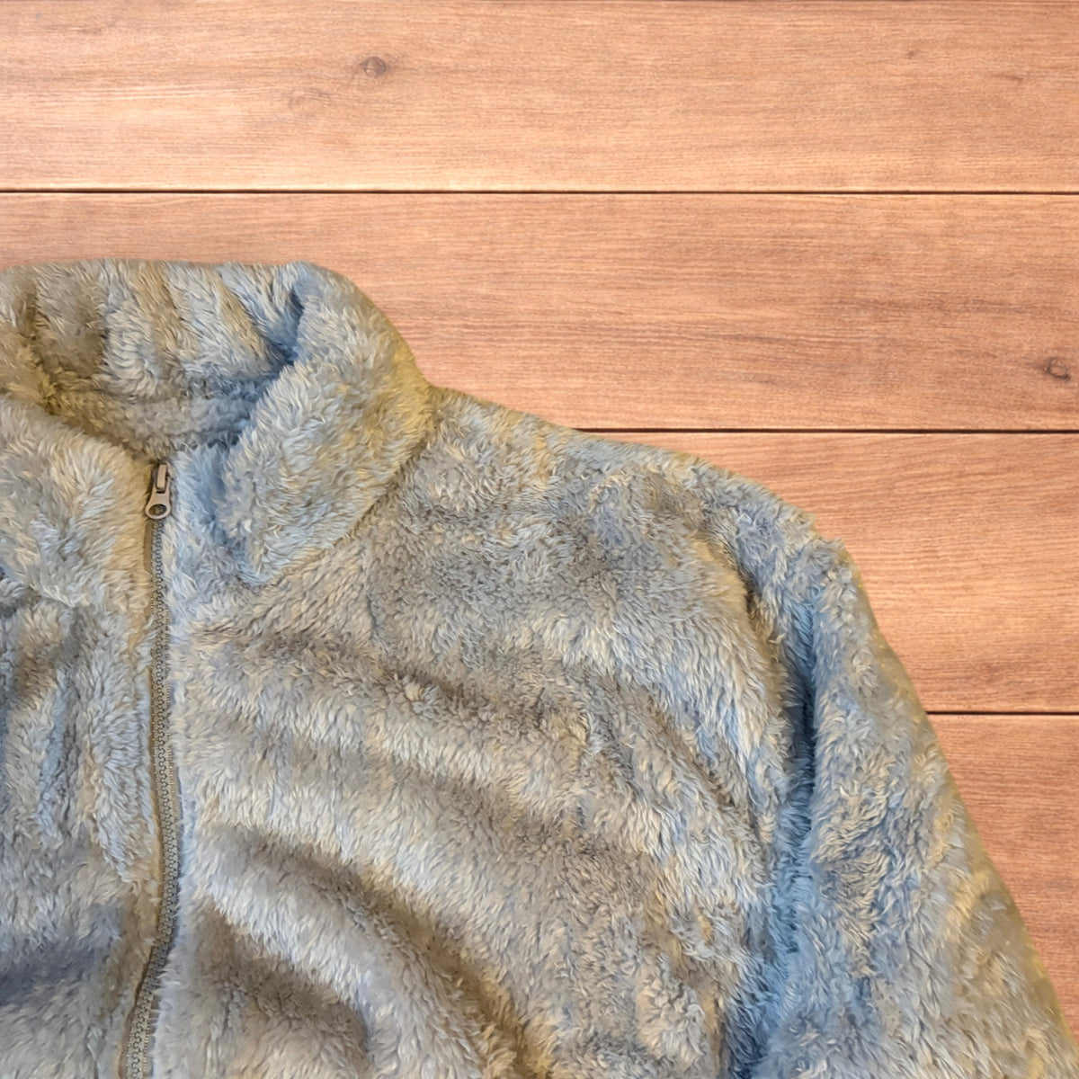 Pale blue fluffy fleece full zip jacket with elasticated hem and high neck