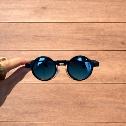 Vintage steampunk style rounded sunglasses in black with green gradient lense.