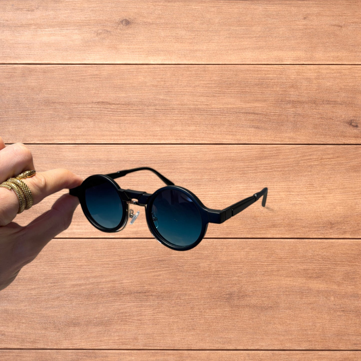 Vintage steampunk style rounded sunglasses in black with green gradient lense.