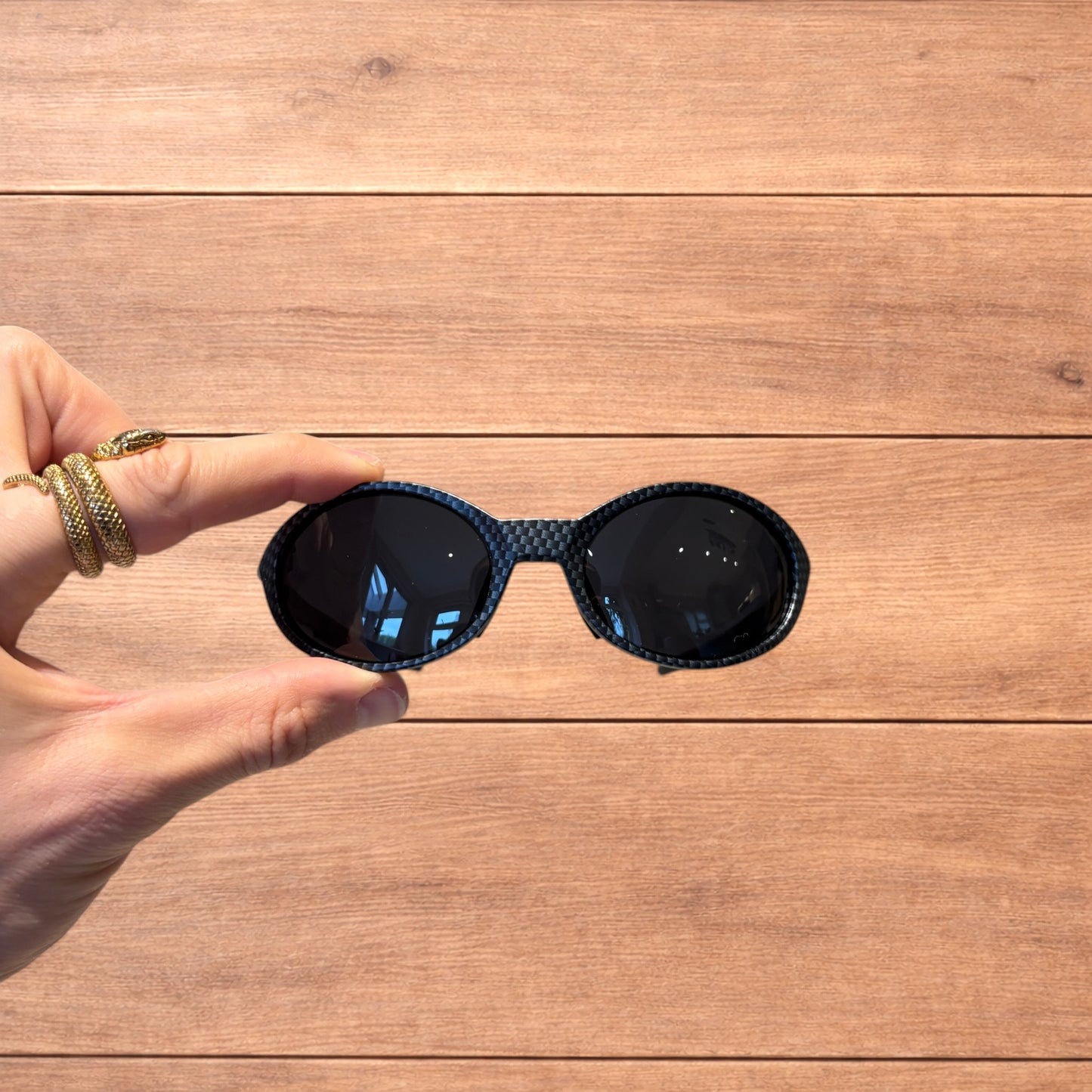 Insane mirrored polarised sunglasses in carbon graphite with black lense.