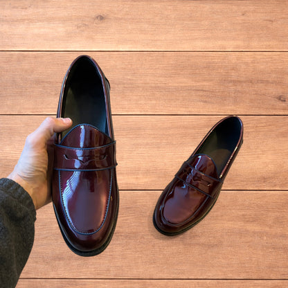 Lovely faux leather penny dress loafers shoes in oxblood red.