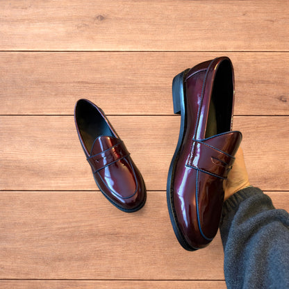 Lovely faux leather penny dress loafers shoes in oxblood red.