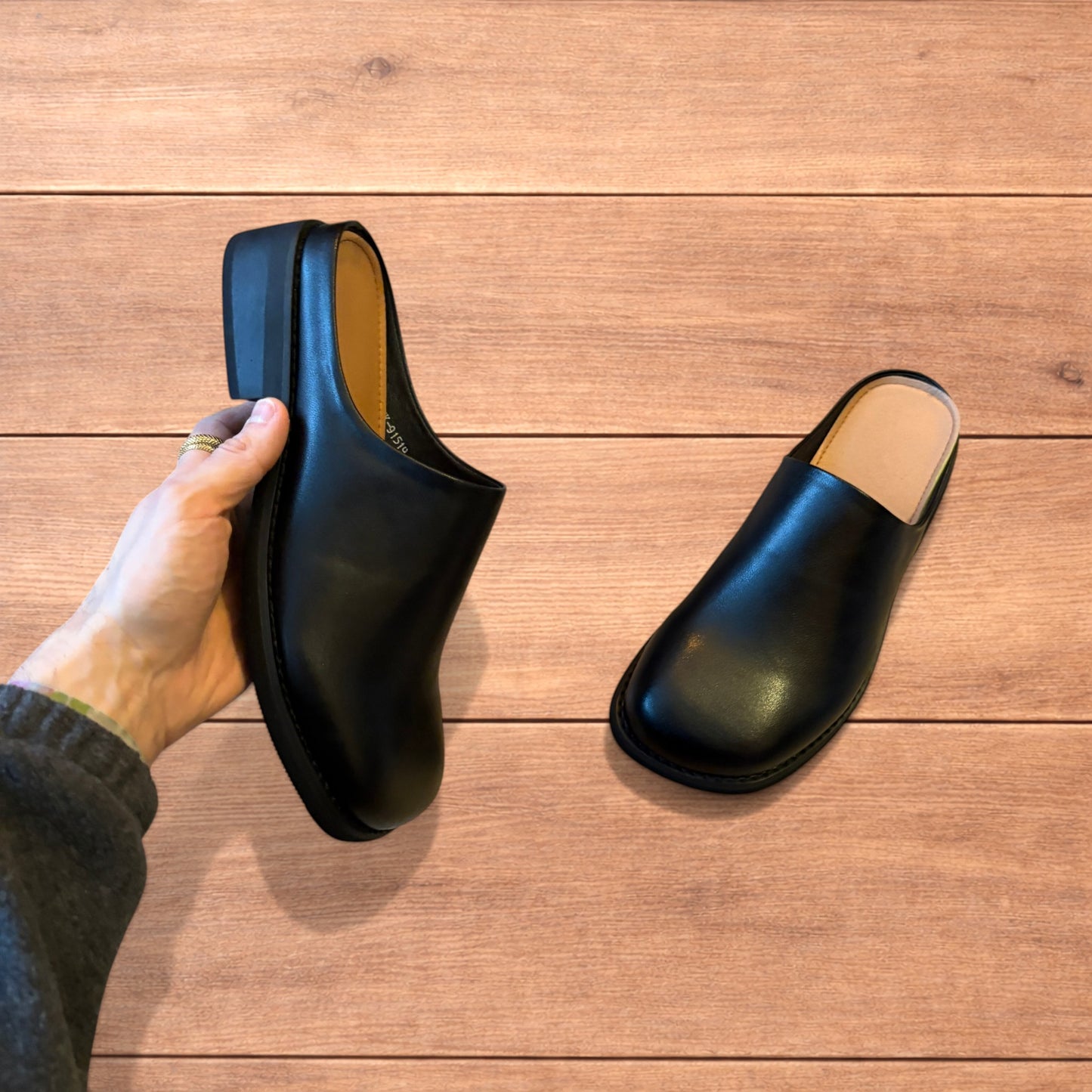 Lovely faux leather slip on clogs slippers in black.