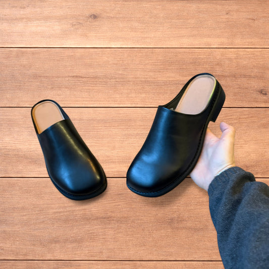 Lovely faux leather slip on clogs slippers in black.