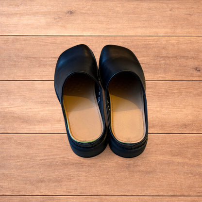 Lovely faux leather slip on clogs slippers in black.