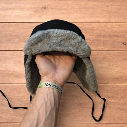 Russian ushanka trapper ear flap winter hat in black/grey colour way.