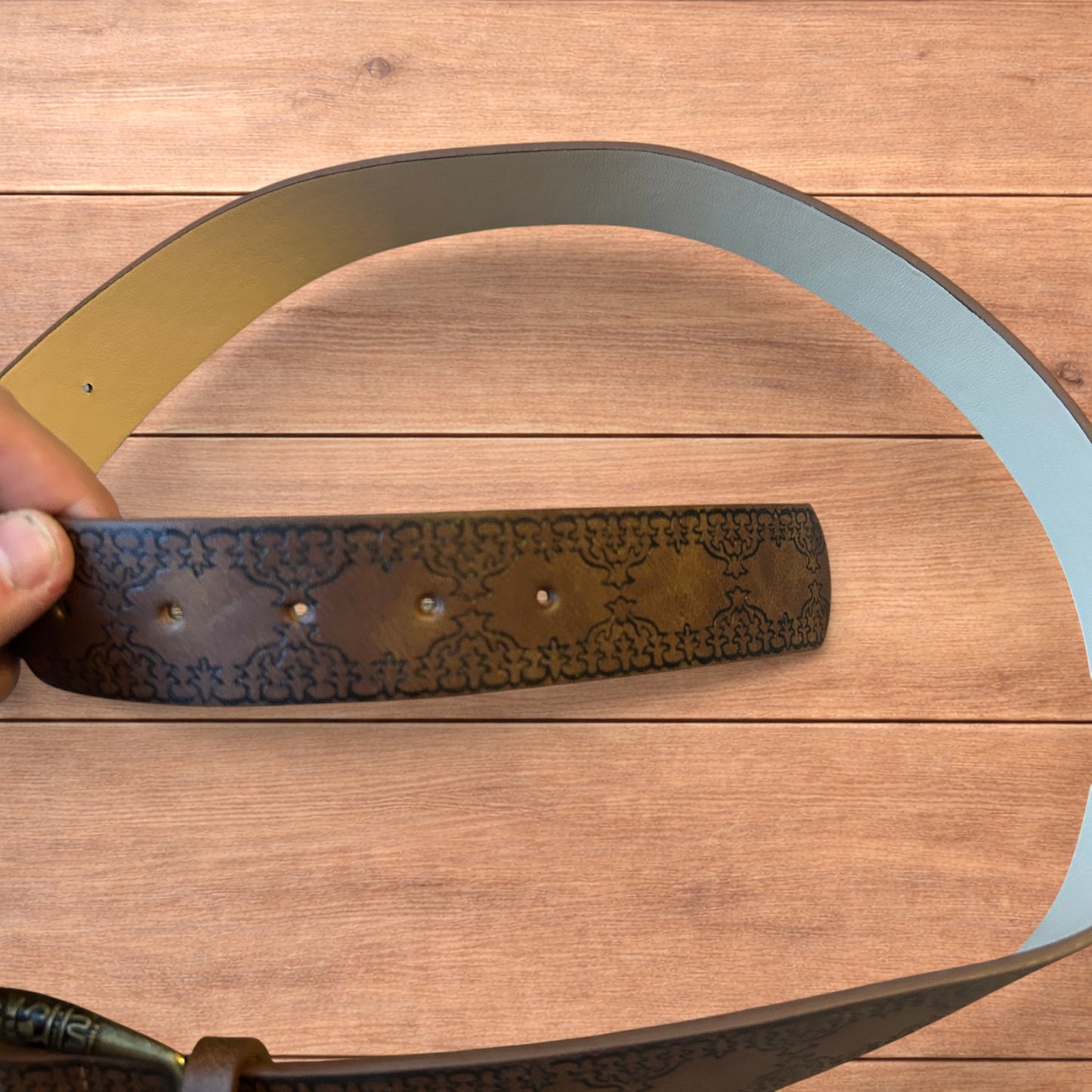 Vintage style faux leather western cowboy belt in brown with bronze trim.