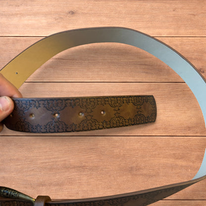 Vintage style faux leather western cowboy belt in brown with bronze trim.
