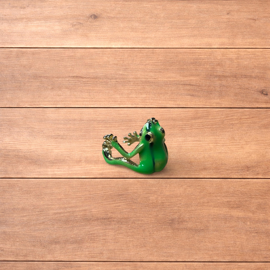 Green and silver novelty frog ring shown from multiple angles and worn on a finger