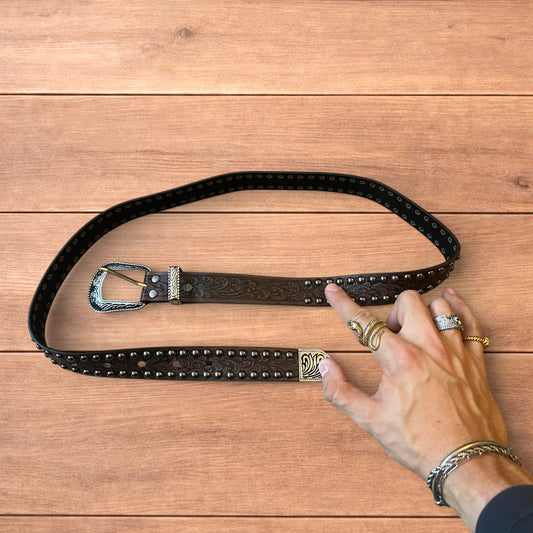 Vintage style faux leather western cowboy gothic belt in brown with silver trim.