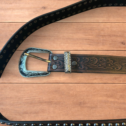 Vintage style faux leather western cowboy gothic belt in brown with silver trim.
