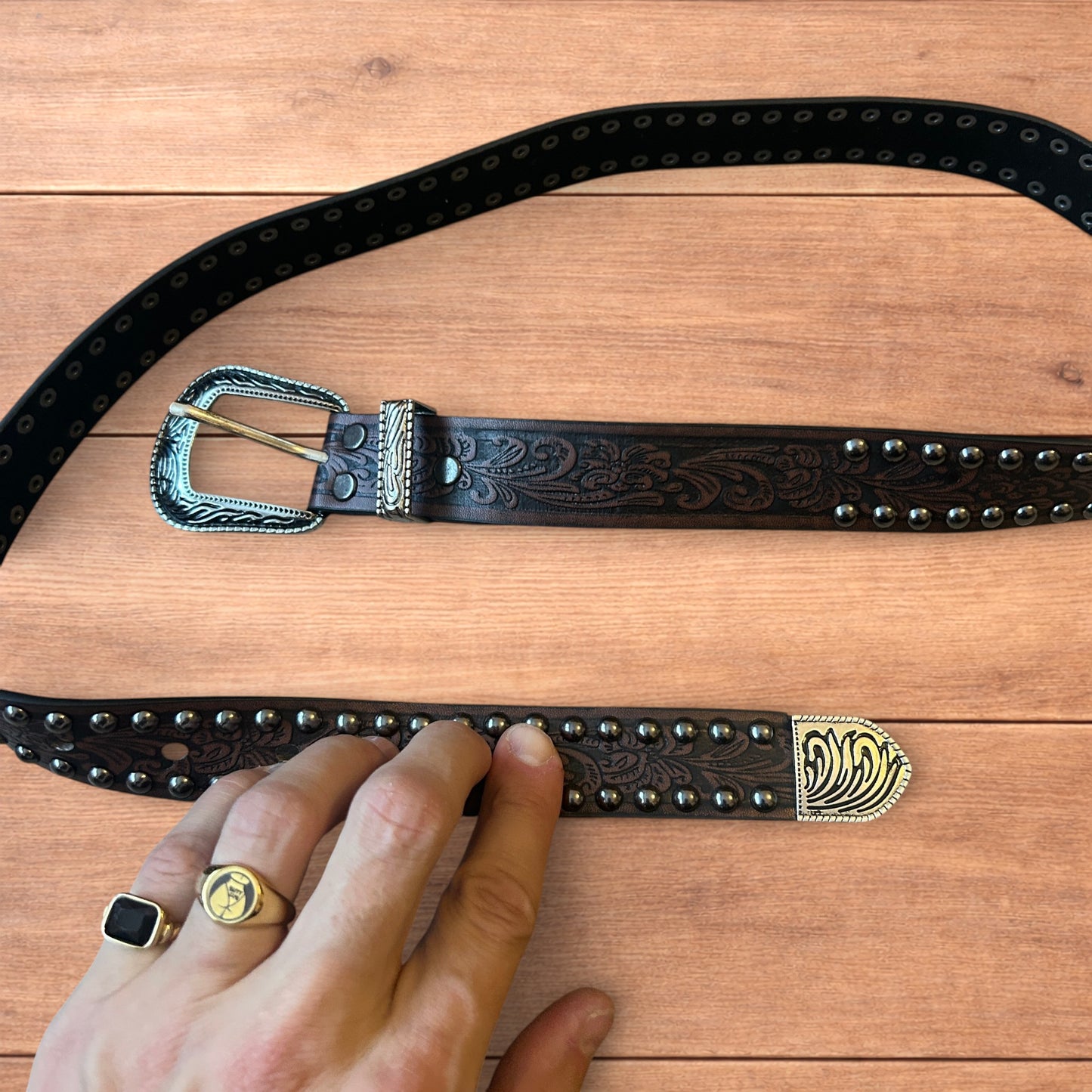 Vintage style faux leather western cowboy gothic belt in brown with silver trim.