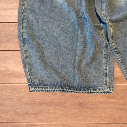 Super baggy wide leg balloon fit jeans in mid blue wash.