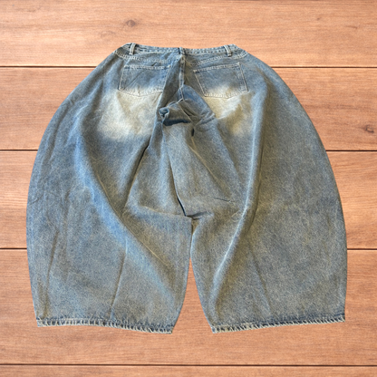 Super baggy wide leg balloon fit jeans in mid blue wash.