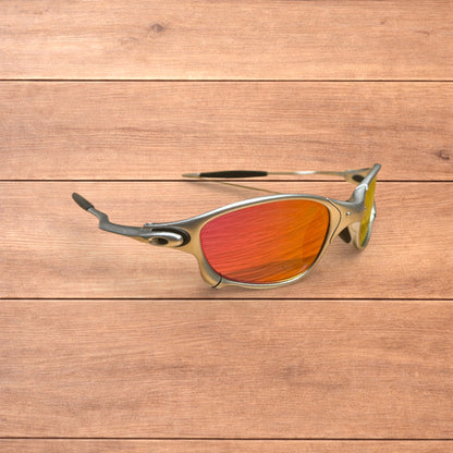 Insane metal frame sunglasses in silver with orange lense.