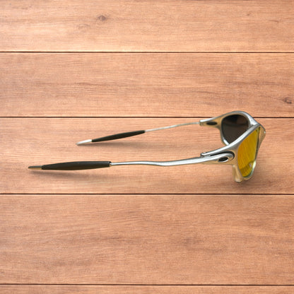 Insane metal frame sunglasses in silver with orange lense.