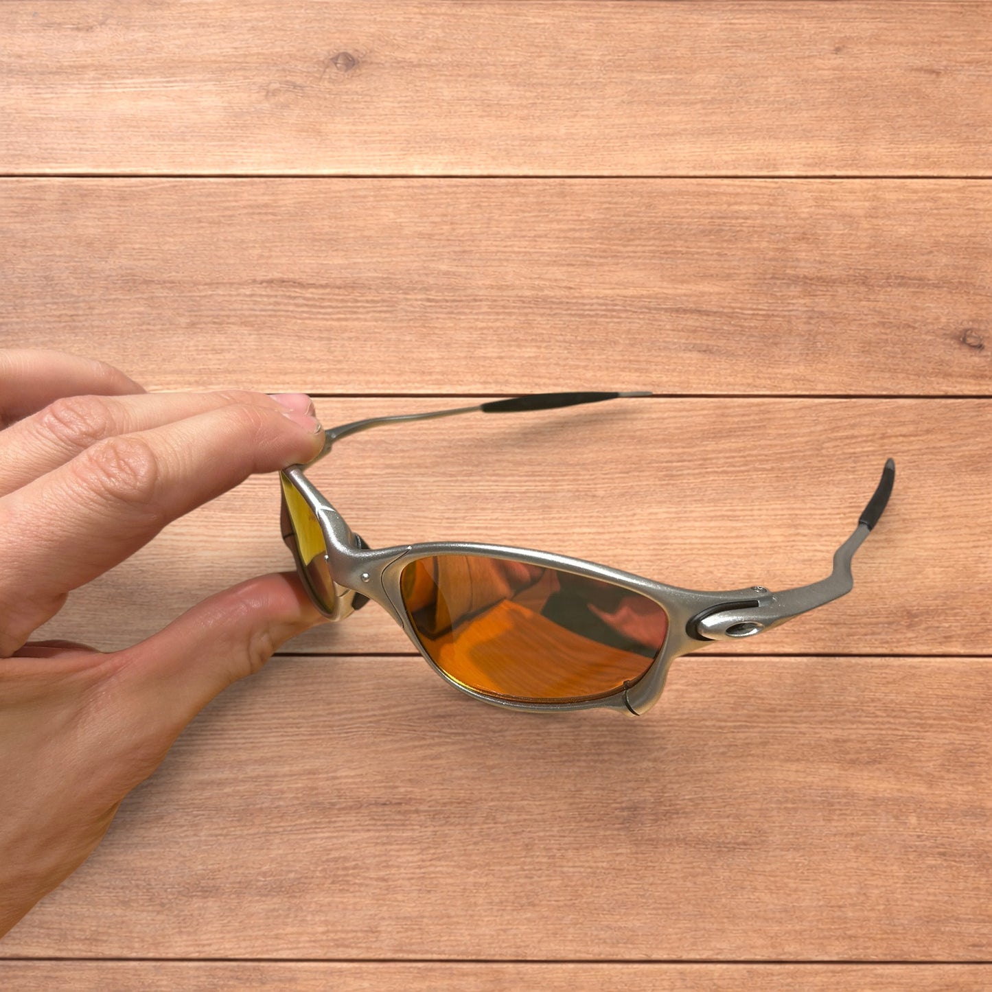 Insane metal frame sunglasses in silver with orange lense.